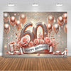 A glamorous balloon backdrop for a 60th birthday featuring gold, pink, and rose-colored balloons and glitter accents.