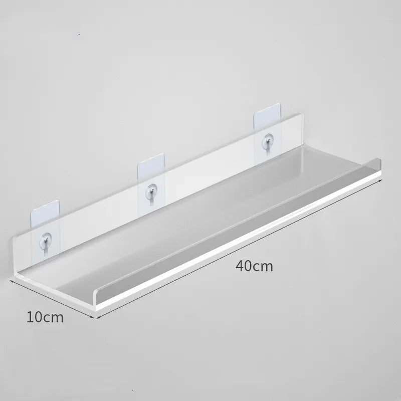 Clear acrylic floating shelf with wall mounts, measuring 40cm long and 10cm deep.