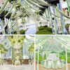 Elegant dark green sheer chiffon curtains draped in a wedding or event setting with greenery and crystal accents