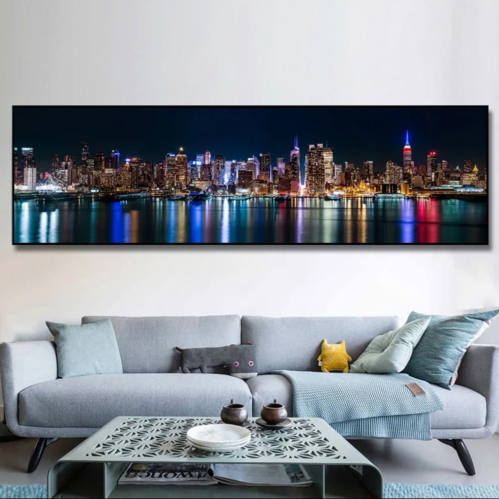 A canvas print depicting the New York City skyline at night with city lights reflecting on water.