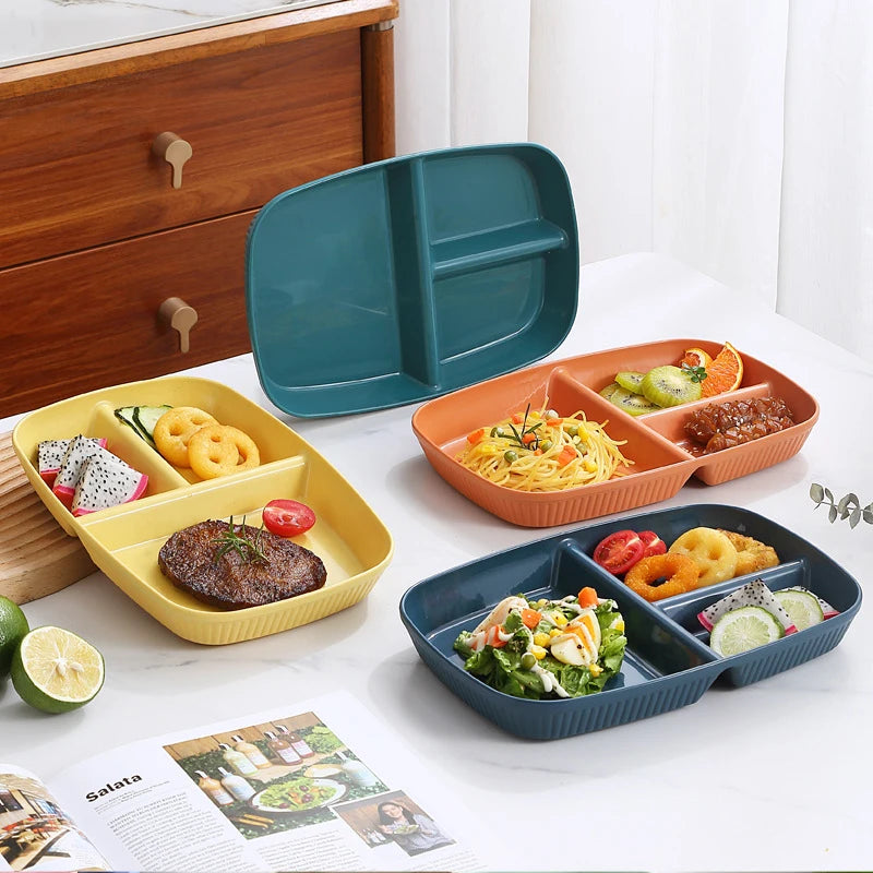 A set of three colored, compartmentalized portion control plates for balanced meals, including a large green plate and smalle