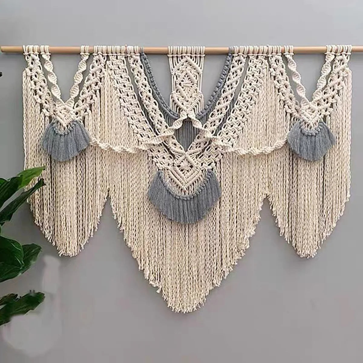 Handwoven boho macrame wall hanging tapestry featuring cream and gray knots