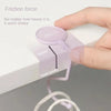 A hand is shown placing a purple silicone hook onto a white surface, demonstrating friction force and stable gravity.