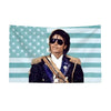 A portrait of Michael Jackson wearing sunglasses and a military-style jacket against an American flag background.
