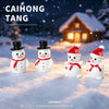 Four white resin snowman figurines wearing black top hats and red scarves standing in snow.