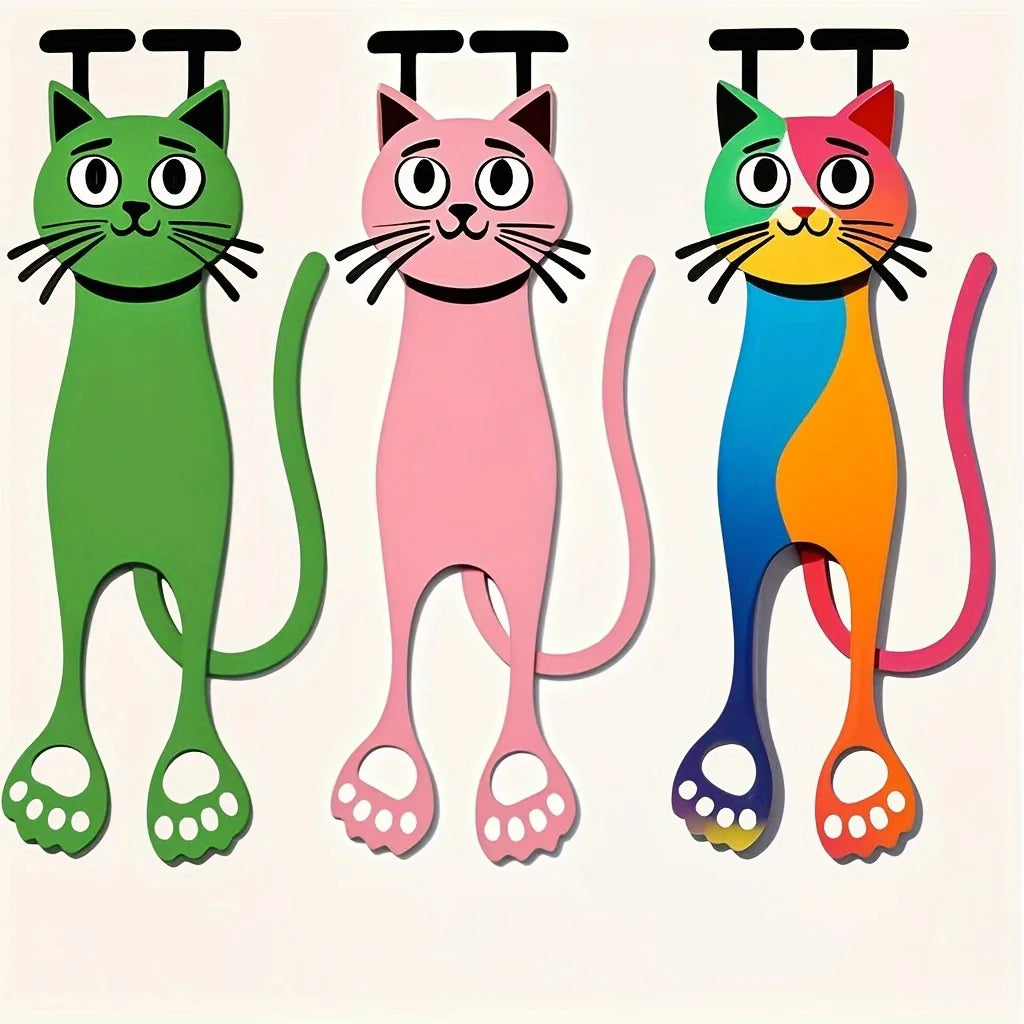 A set of three decorative acrylic cat bookmarks in green, pink, and orange colors.