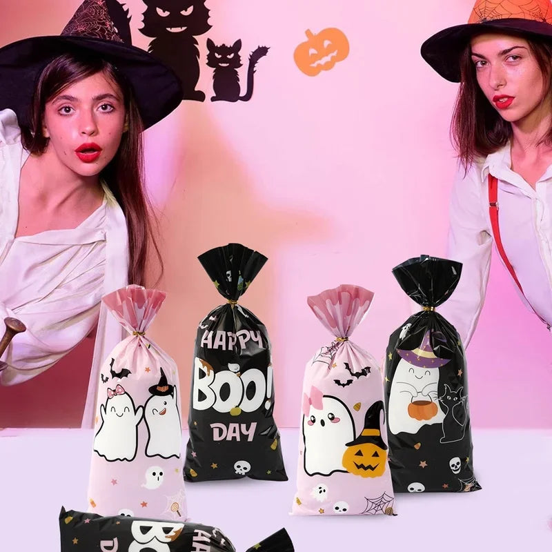 A collection of Halloween candy treat bags featuring a little boo design in black and pink packaging.