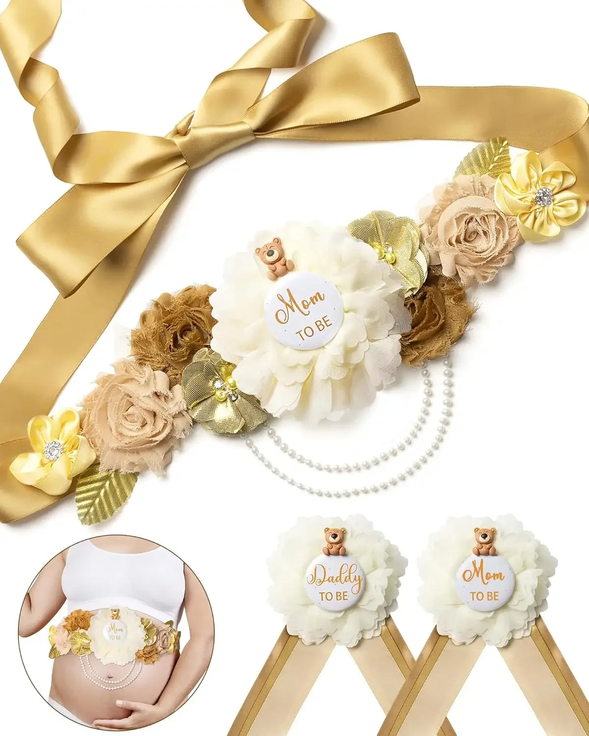 A gold satin ribbon with floral accents and a pearl chain, featuring a Mom to Be corsage pin set.