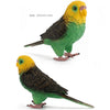Hand-painted resin parrot figurine with yellow head and green body, shown in profile.