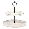 A black metal cupcake stand with two wooden tiers, featuring a decorative iron topper.
