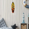 A wooden wall decor sign shaped like a surfboard with palm trees and the text LIVIN ON ISLAND TIME.