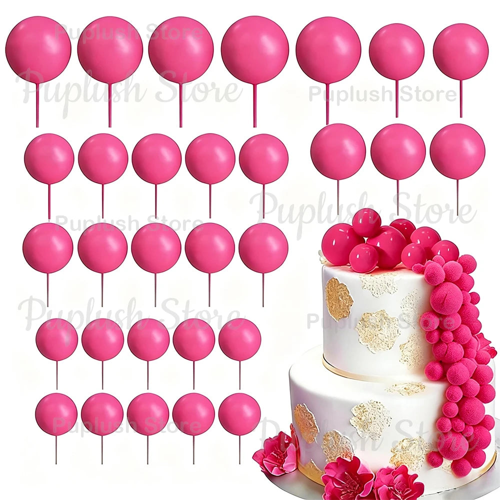 A set of pink foam cake toppers on sticks for decoration
