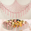 Pink multi-use storage hammock for toys and plushies with dangling fringe