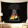 Black wall art featuring a stylized skull design with fiery elements and dark, spiky text.