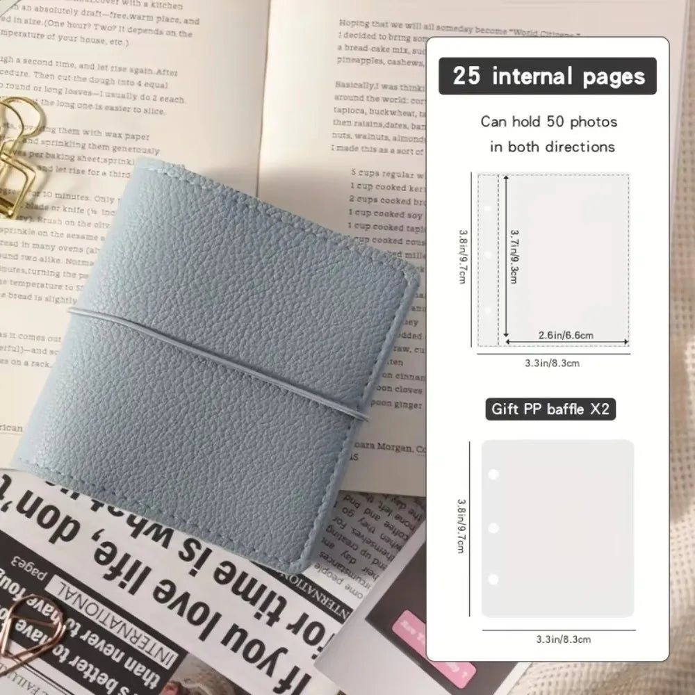 A light blue faux leather photo album with a cover featuring a design and an interior page showing a photo layout.
