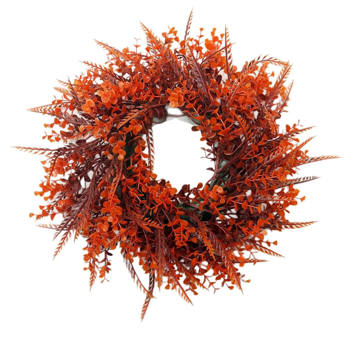 An artificial eucalyptus wreath with reddish-orange foliage used for autumn decor.