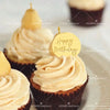 A golden cake topper with the words Happy Birthday placed on a vanilla cupcake with cream frosting.