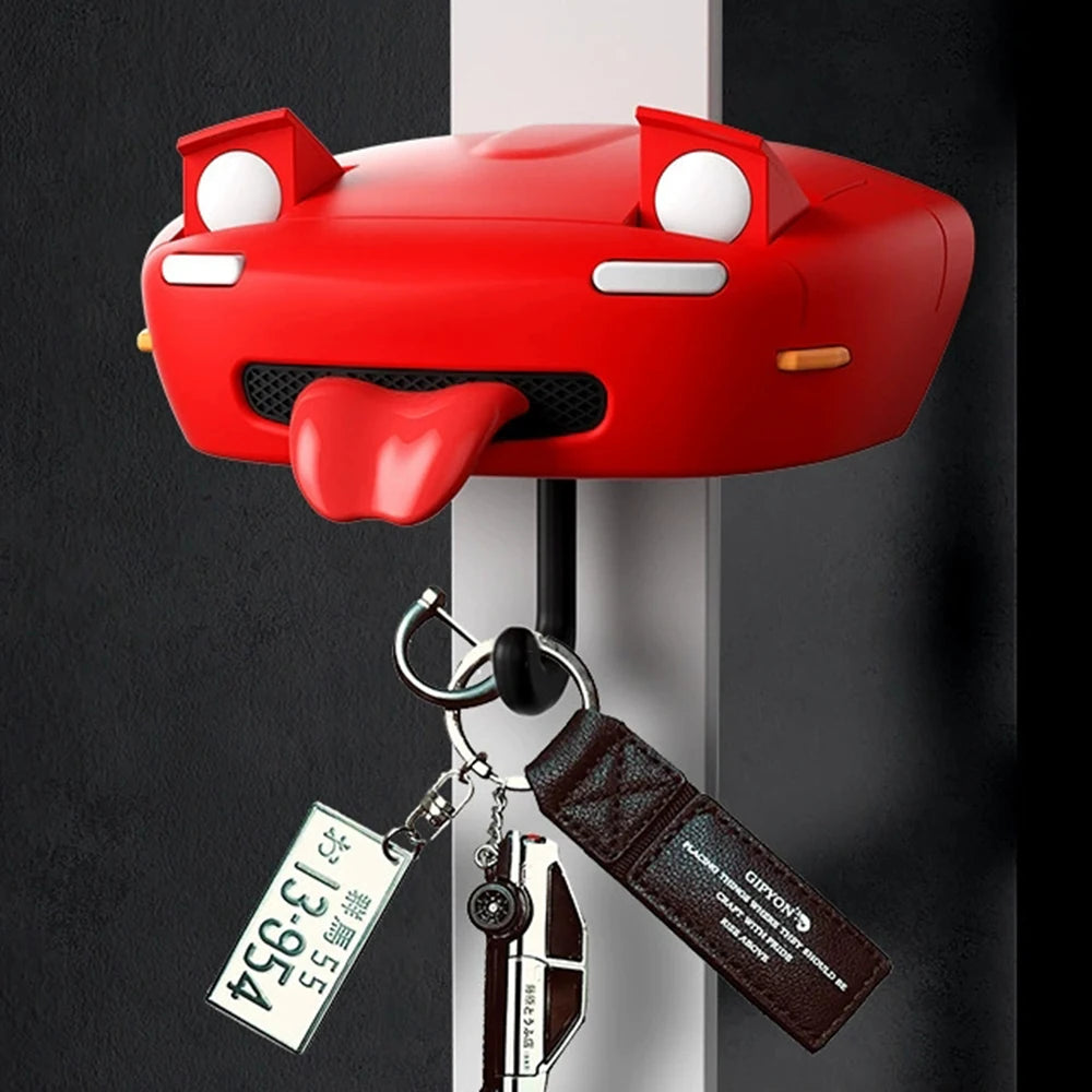 A red classic car headlight key holder with an orange-colored plastic face and a leather strap.