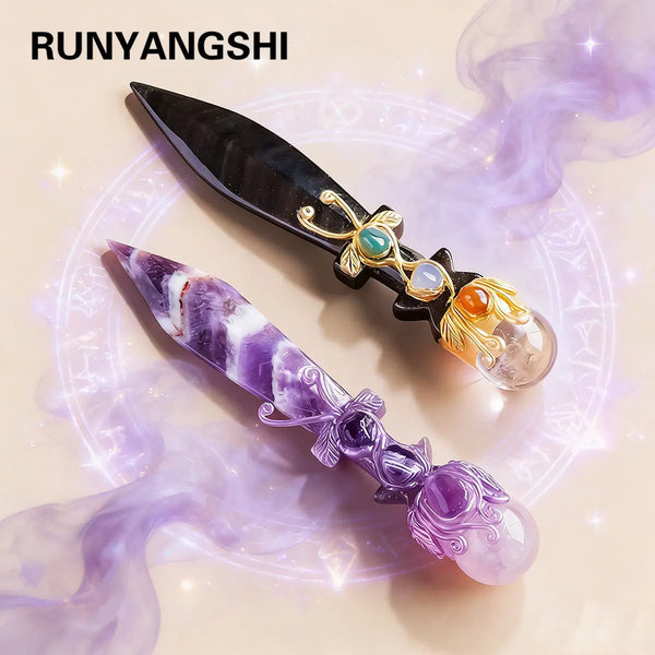 A pair of obsidian and amethyst crystal blades or knives displayed on a glowing circular background.