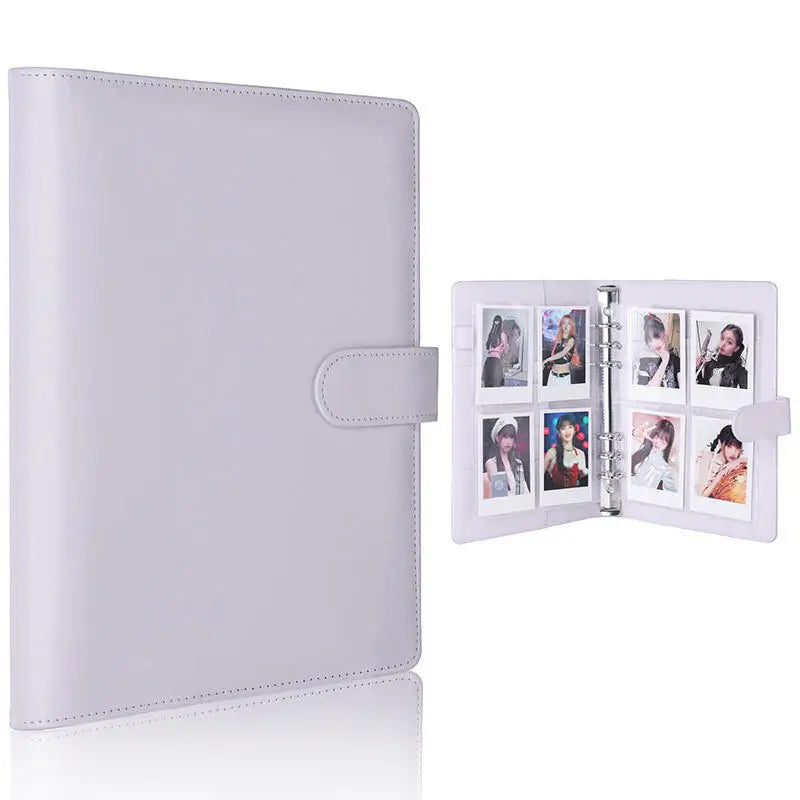 A white A5 PU leather photocard binder with a cover and an open section displaying several photos.