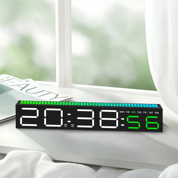 A black LED digital alarm clock displaying 20:38:56 on a white windowsill.