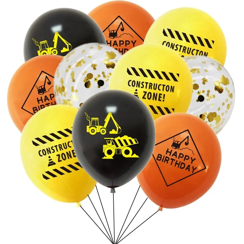 A bunch of latex balloons in yellow, orange, and black featuring construction themes like happy birthday and construction zon