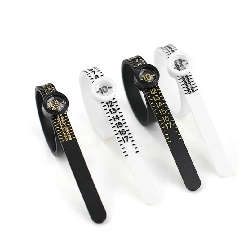 A set of adjustable ring sizers with built-in magnifiers shown against a white background.