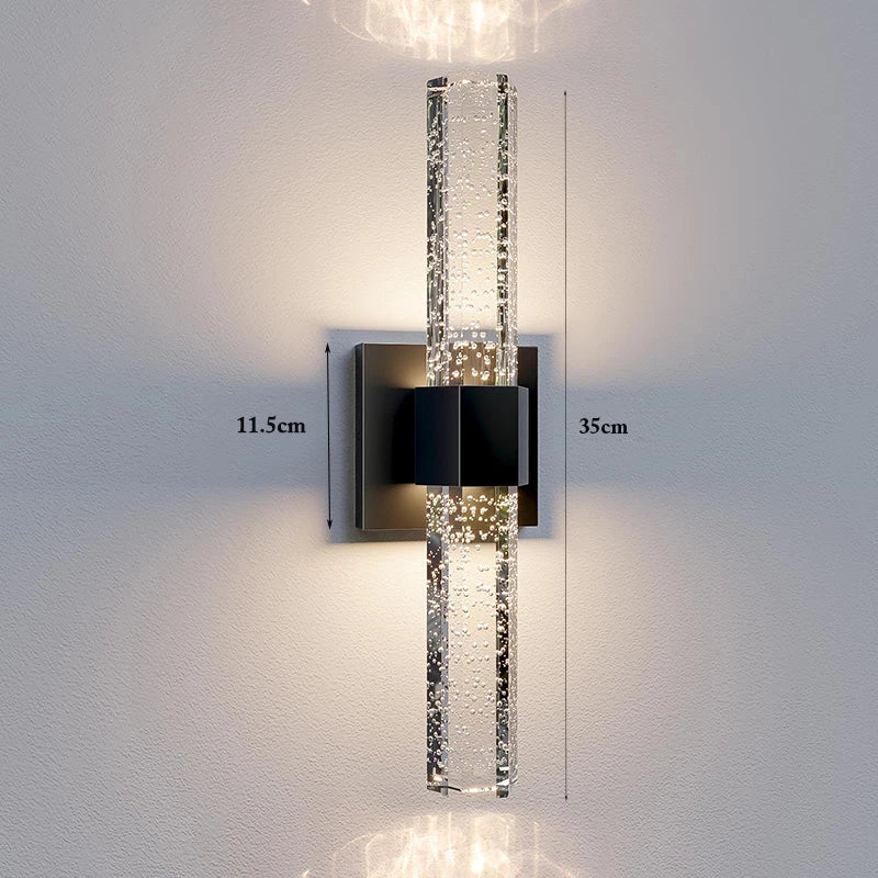 Modern bubble crystal LED wall sconce mounted on a white wall with dimension lines.
