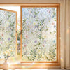 A close-up view of a window with decorative privacy film featuring floral patterns and UV protection.