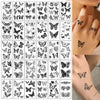 A collection of realistic black butterfly temporary tattoos displayed on skin.
