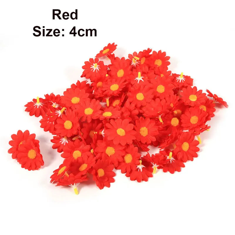 A pile of red artificial sunflower and daisy heads, measuring 4cm each.