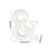 A white LED alphabet letter light shaped like an ampersand, illuminated with warm white lights.