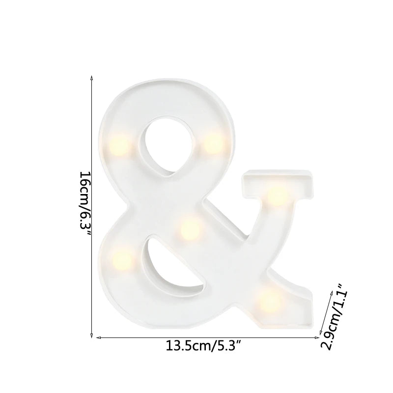 A white LED alphabet letter light shaped like an ampersand, illuminated with warm white lights.