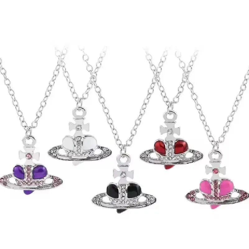 A set of vintage diamond-inlaid Saturn pendant necklaces featuring silver chains and gemstone charms.