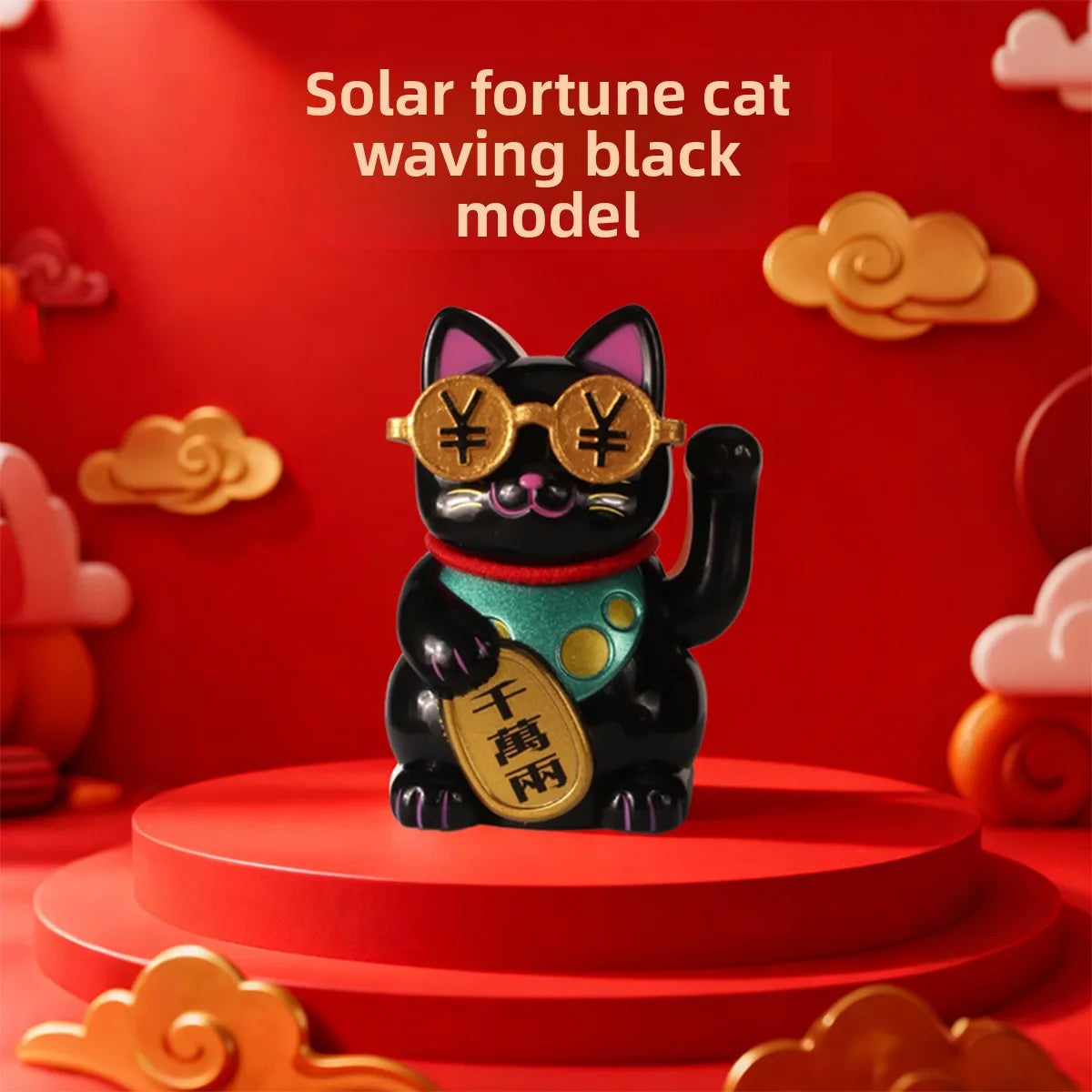 A black cat ornament with gold eyes and a green collar sitting on a red circular base.