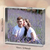 A rectangular acrylic photo ornament displaying a portrait of a young man and woman in a field of purple lavender flowers.
