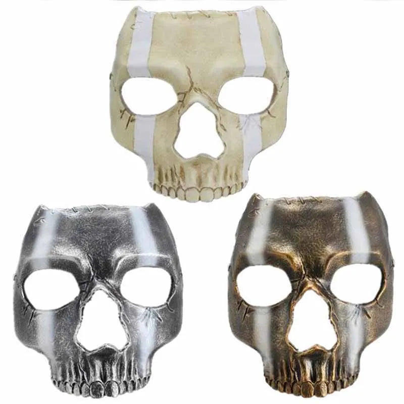 A set of three resin Halloween skeleton ghost full face masks in silver, gold, and beige tones.