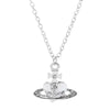 Silver pendant necklace featuring a diamond-inlaid Saturn design.