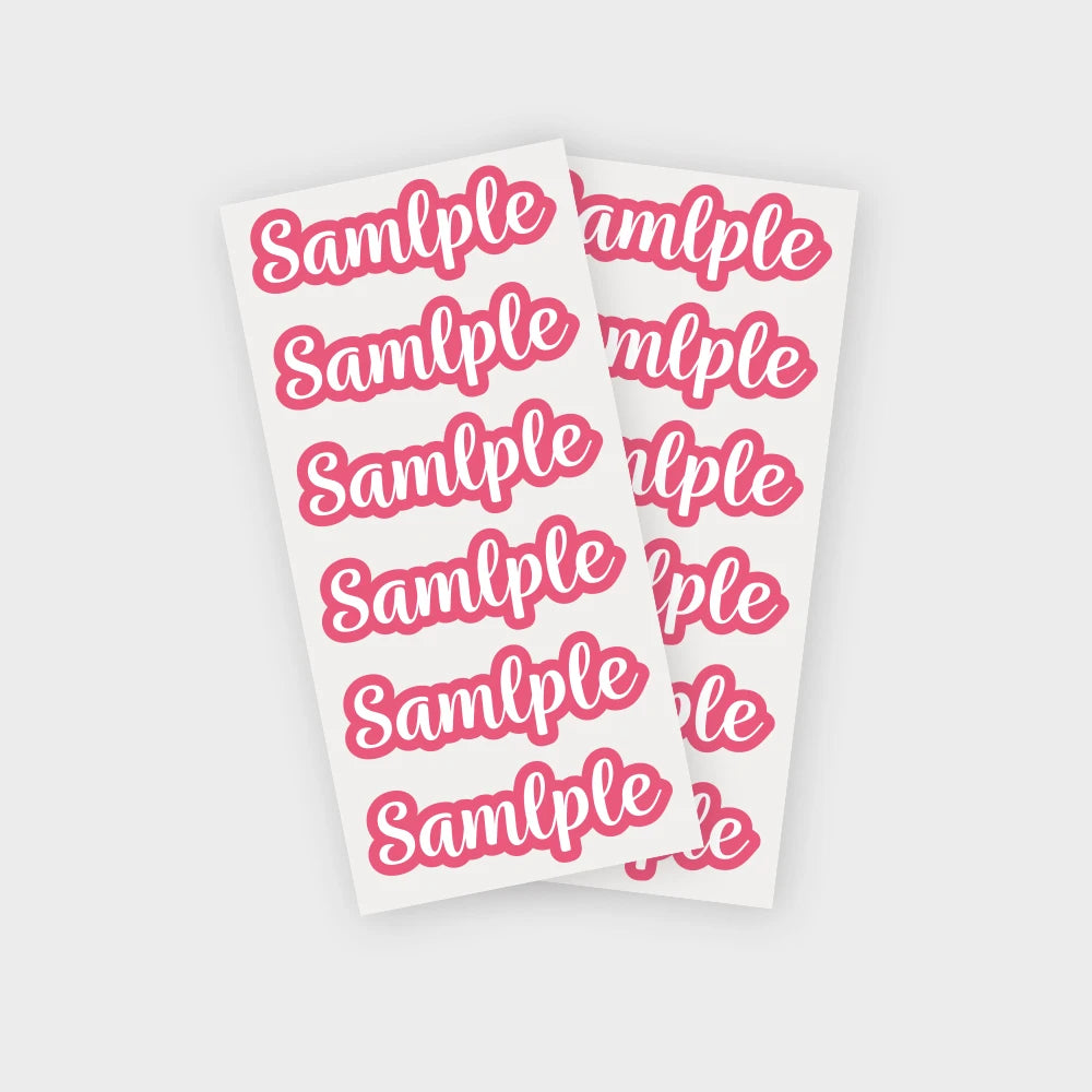 A sheet of pink and white labels with the word sample repeated multiple times.