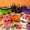 A collection of reusable Halloween candy bags in various colors and designs, including pumpkins, cats, and spooky faces.