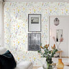 Boho floral peel and stick wallpaper featuring a dense pattern of multicolored wildflowers on a white background.