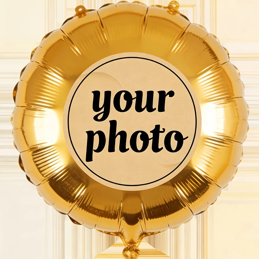 A golden foil balloon shaped like a heart, featuring a circular label for a custom photo.