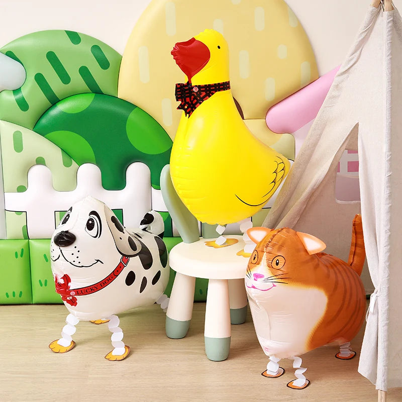 A set of cartoon farm animal foil balloons including a yellow chicken, a black and white dog, and an orange cat.