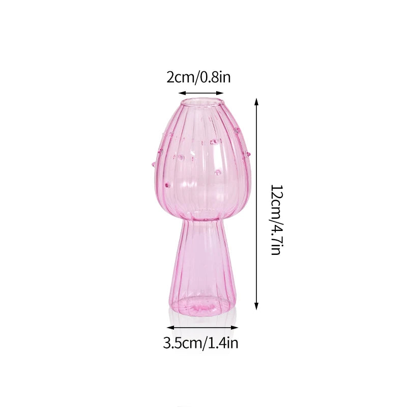 Vase décoratif en forme de champignon en verre rose, avec un large col et une base étroite