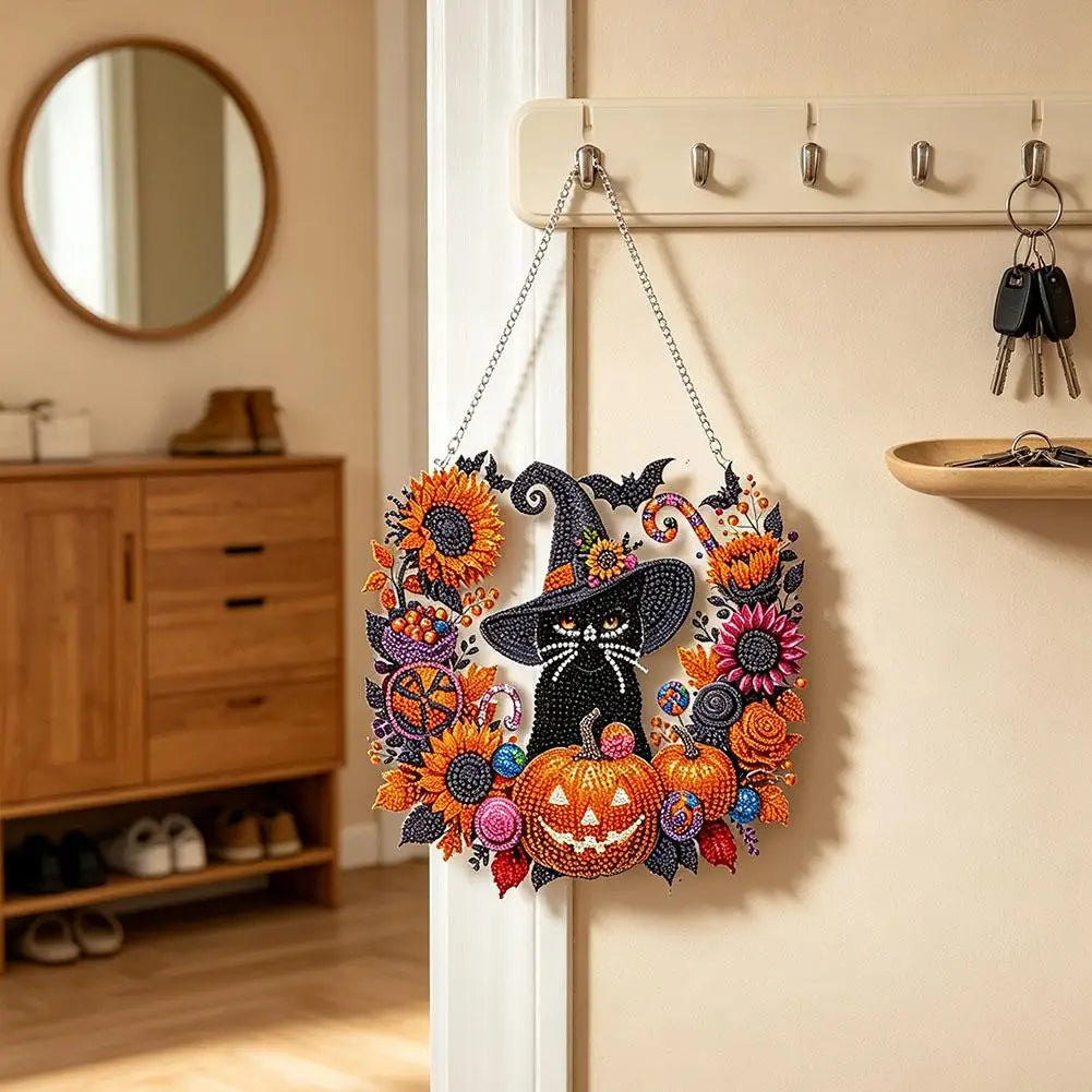 Acrylic diamond painting kit featuring black cat, moon, skull, and pumpkin designs on a string.