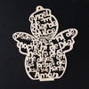 A wooden angel ornament cut from a tree slice, featuring various religious names and words carved into the wood.