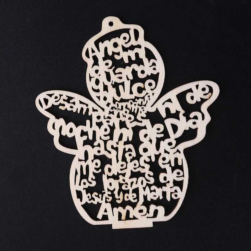 A wooden angel ornament cut from a tree slice, featuring various religious names and words carved into the wood.