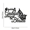 Black metal wall decor featuring the words Thankful Grateful and truly Blessed in elegant script with butterfly accents