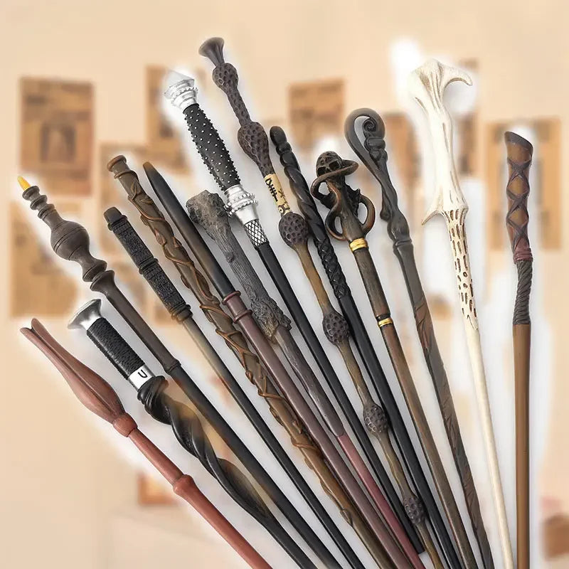 A collection of character-inspired metal and resin magic wands displayed against a light background.