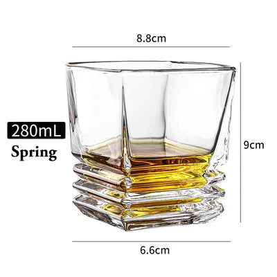 Clear whiskey glass with a heavy, octagonal base and a wide mouth, measuring 8.8cm high.